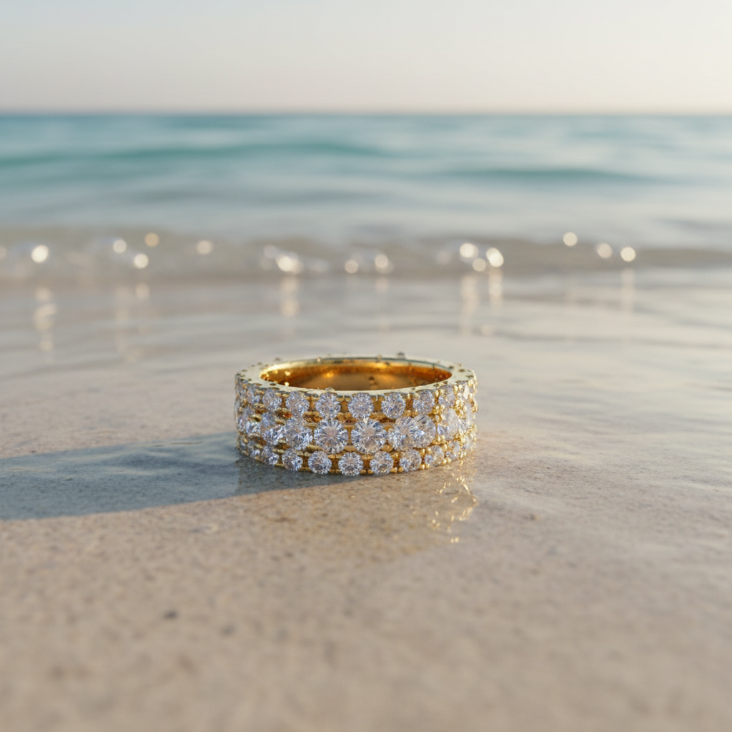 Gold Ring on Sand and Water